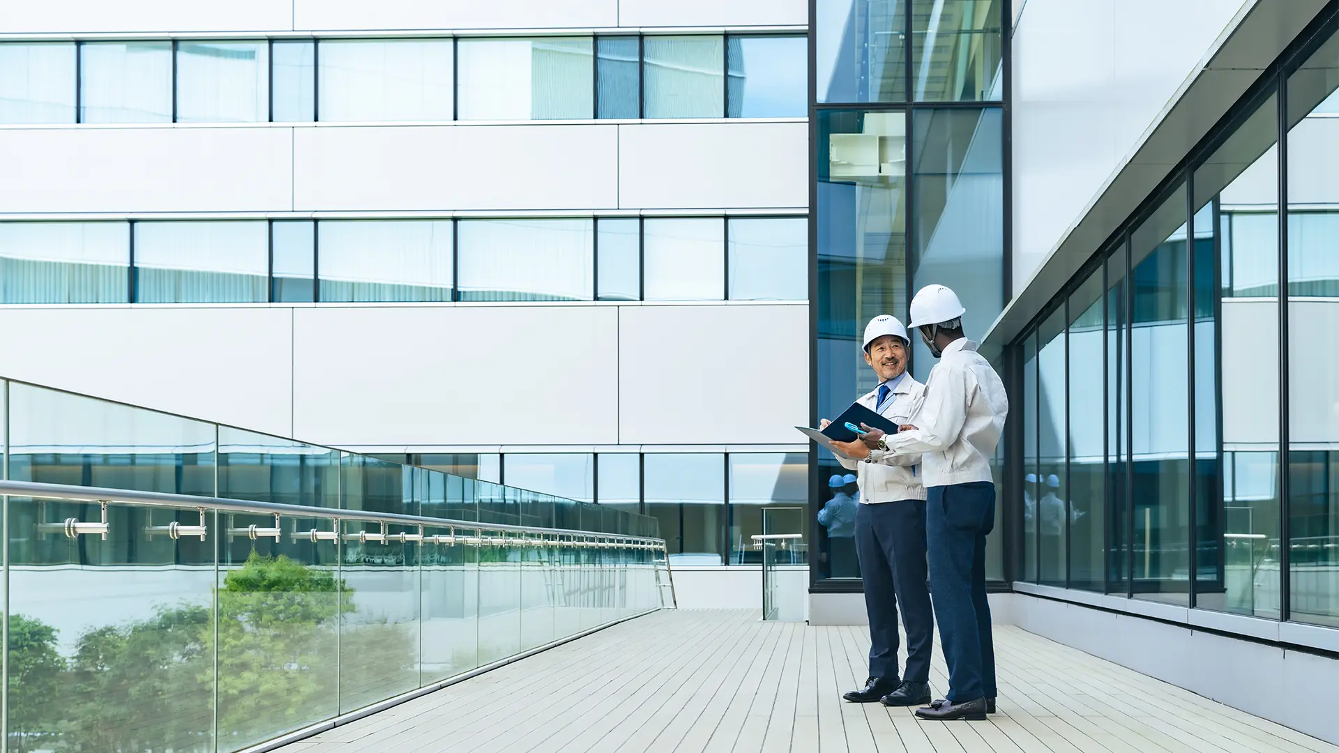 Engineers in front of a building