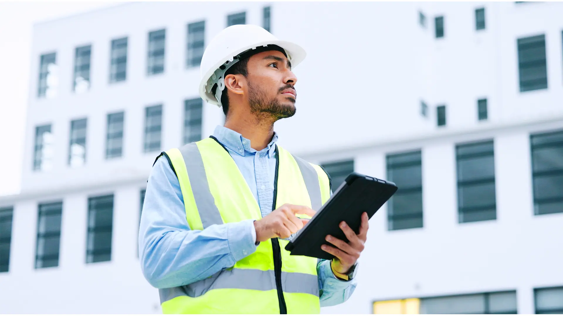 Male engineer inspecting construction site
