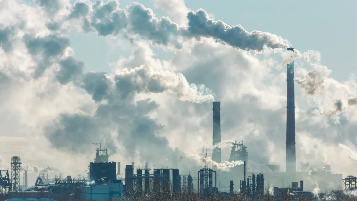 Thick cloud of smoke billowing from a factory
