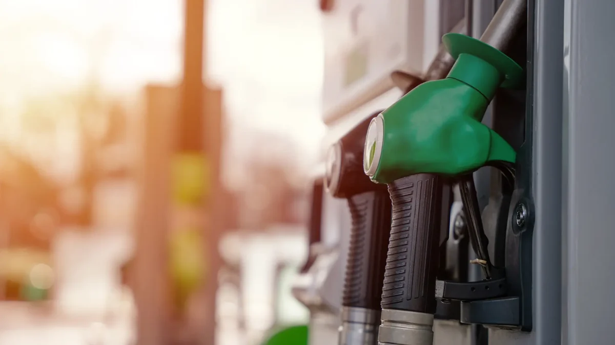 Close up of diesel and petrol fuel pistols at a gas station