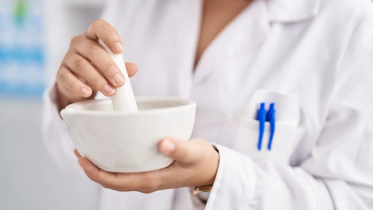 A pharmacist mixing medicine