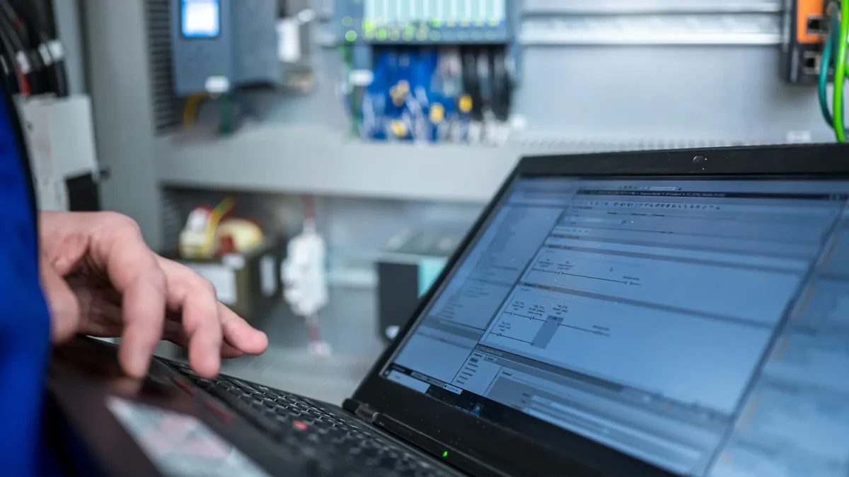 A programmer checks the correct function of the PLC program